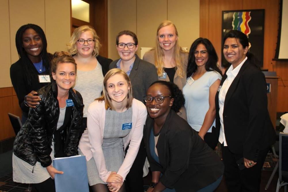 Image 1 of 15 A group of women standing together, smiling